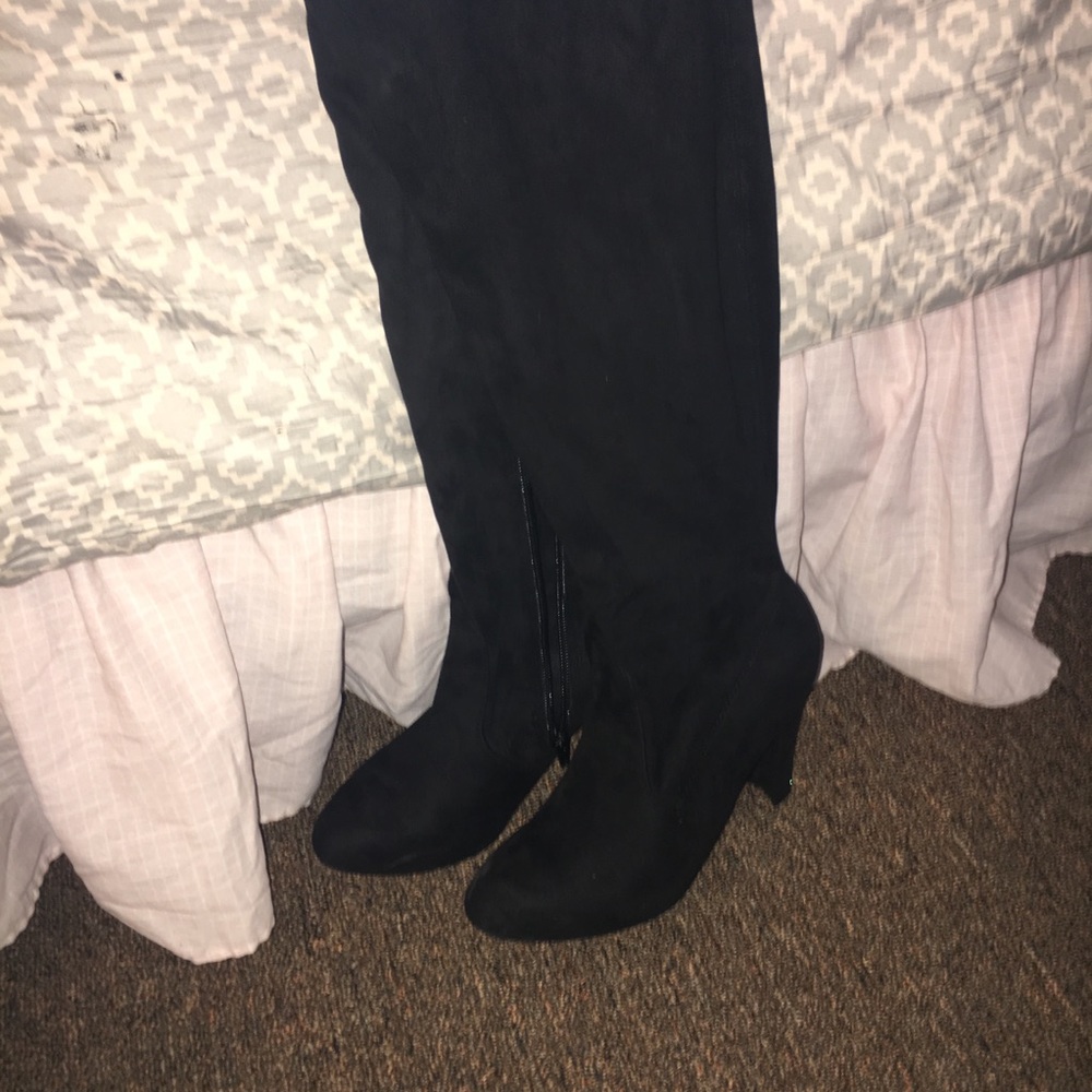 Over the knee black high heeled boots